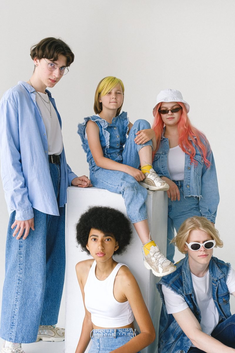 A group of young people in denim jackets and shirts